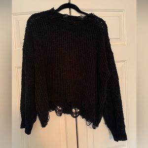 Distressed, cropped black sweater